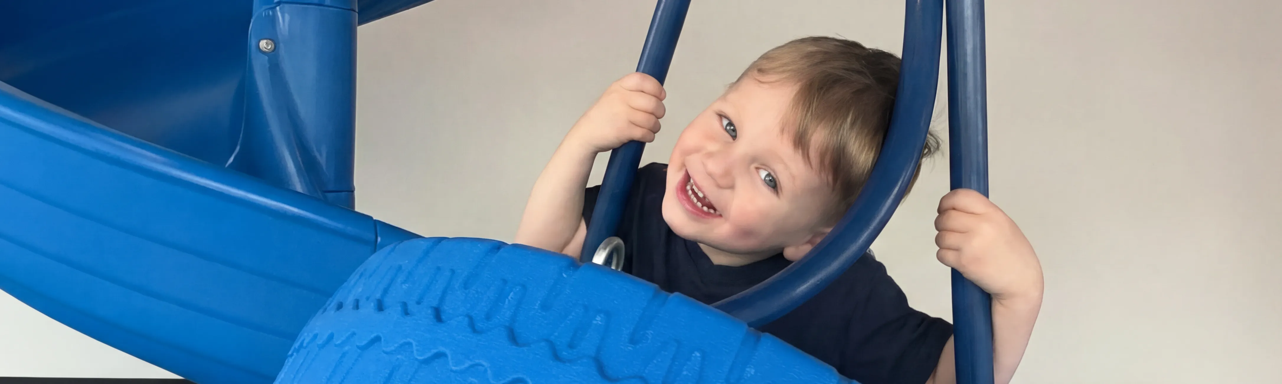 Child smiling and playing at Autism Centers of Utah