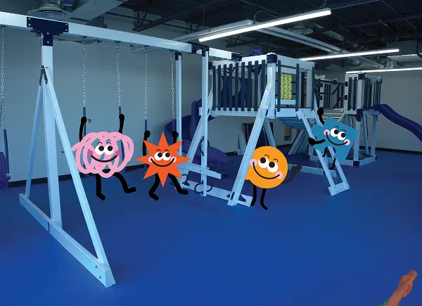 Sensory gym with swings and climbing equipment at Autism Centers of Utah