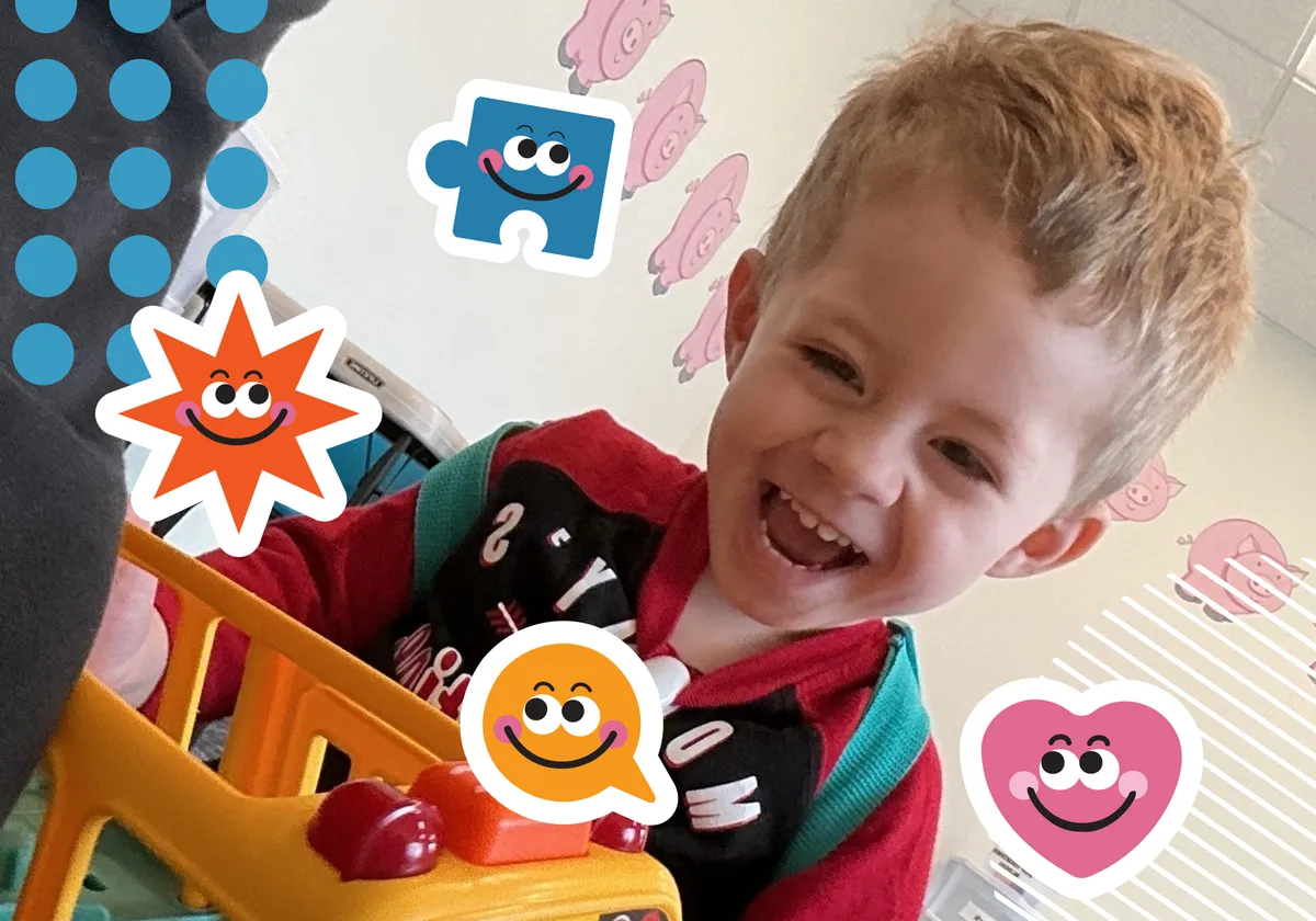 A child laughing and playing at Autism Centers of Utah